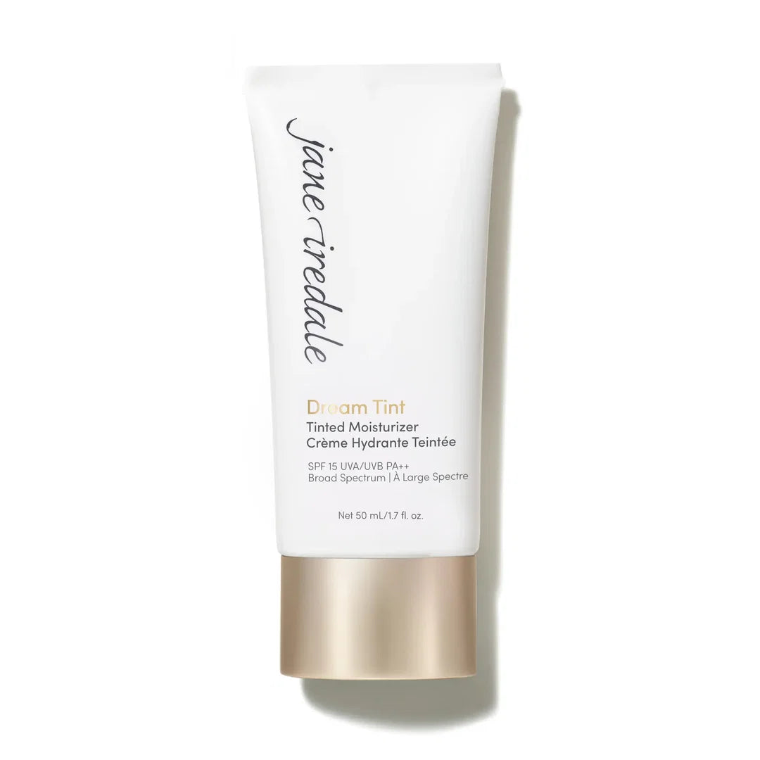jane iredale Dream Tint Tinted Moisturiser in a white tube with a gold-toned cap, photographed on a white background.