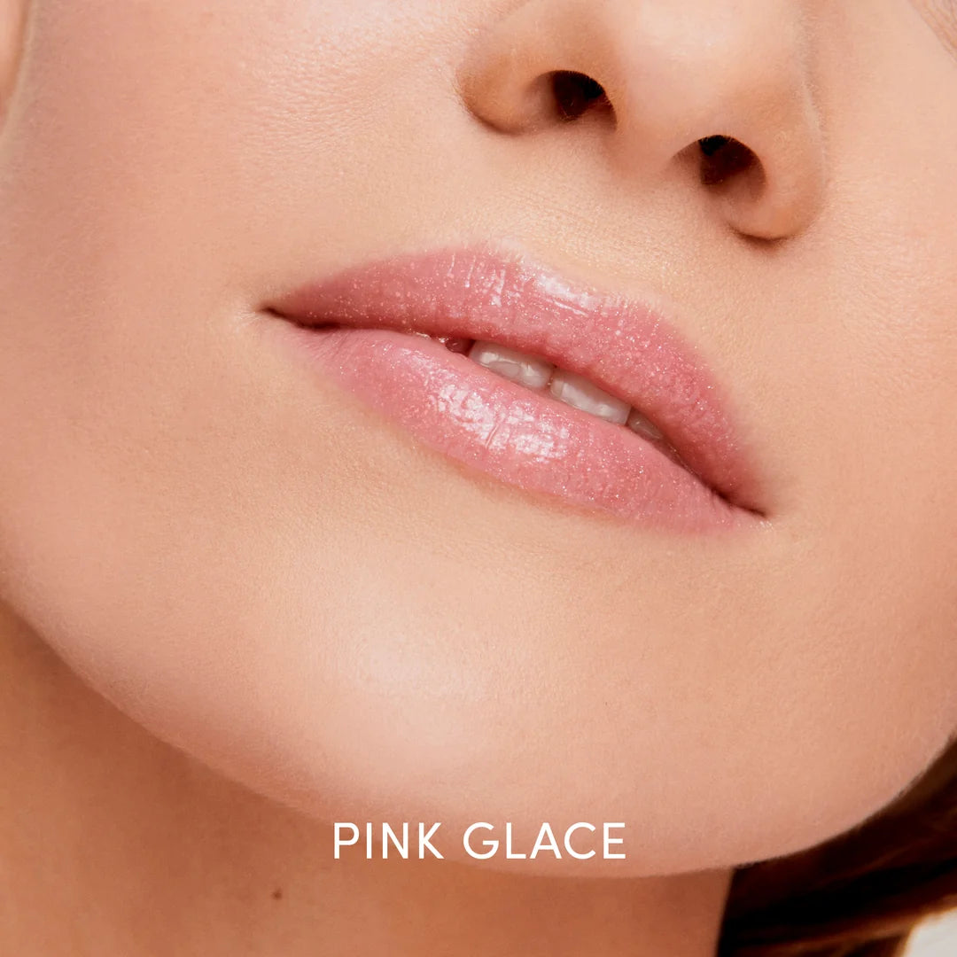 Close-up of a model wearing jane iredale HydroPure Hyaluronic Lip Gloss in Pink Glace, showing a glossy pink finish.