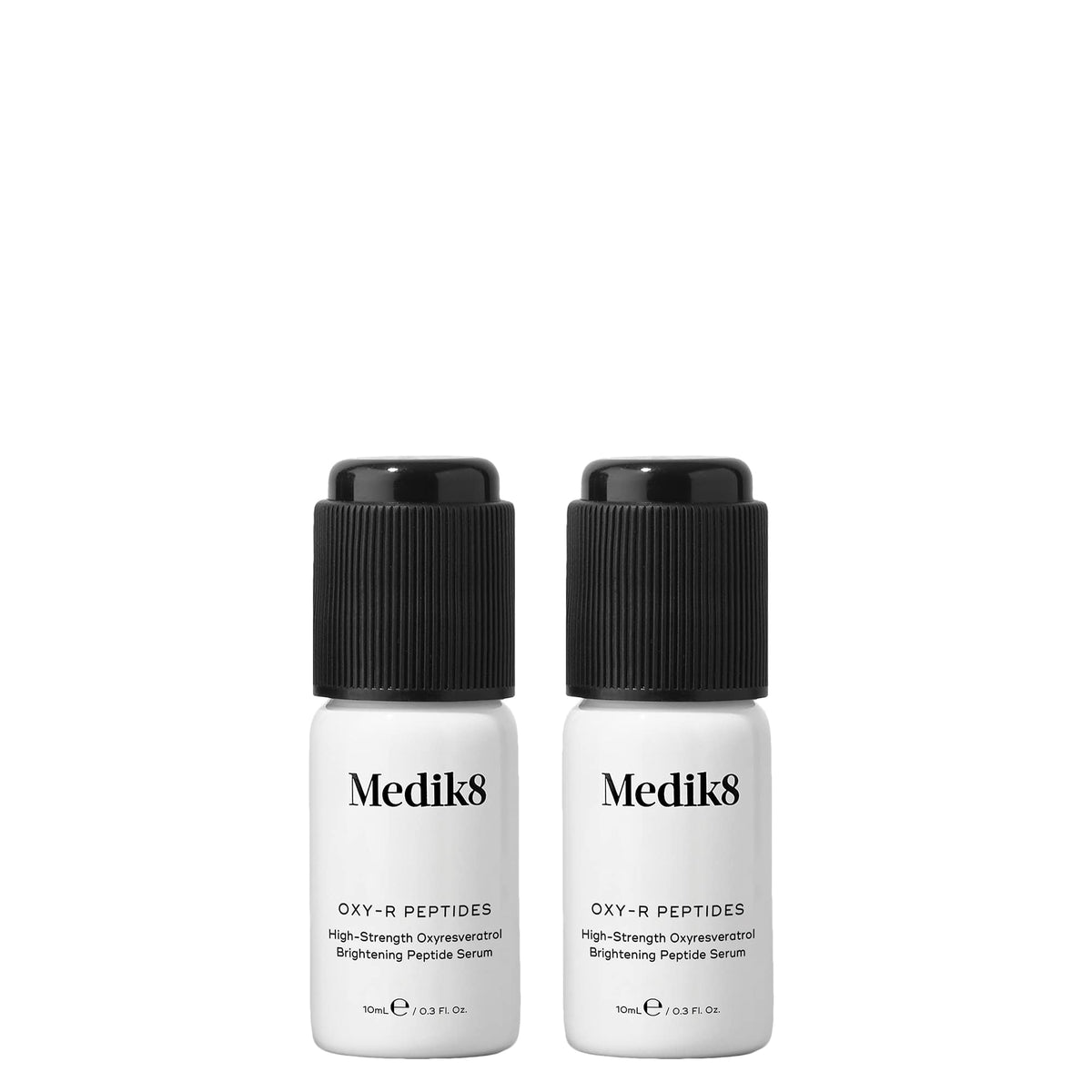 Two Medik8 Oxy-R Peptides serum bottles with white labels and black activation caps on a white background.