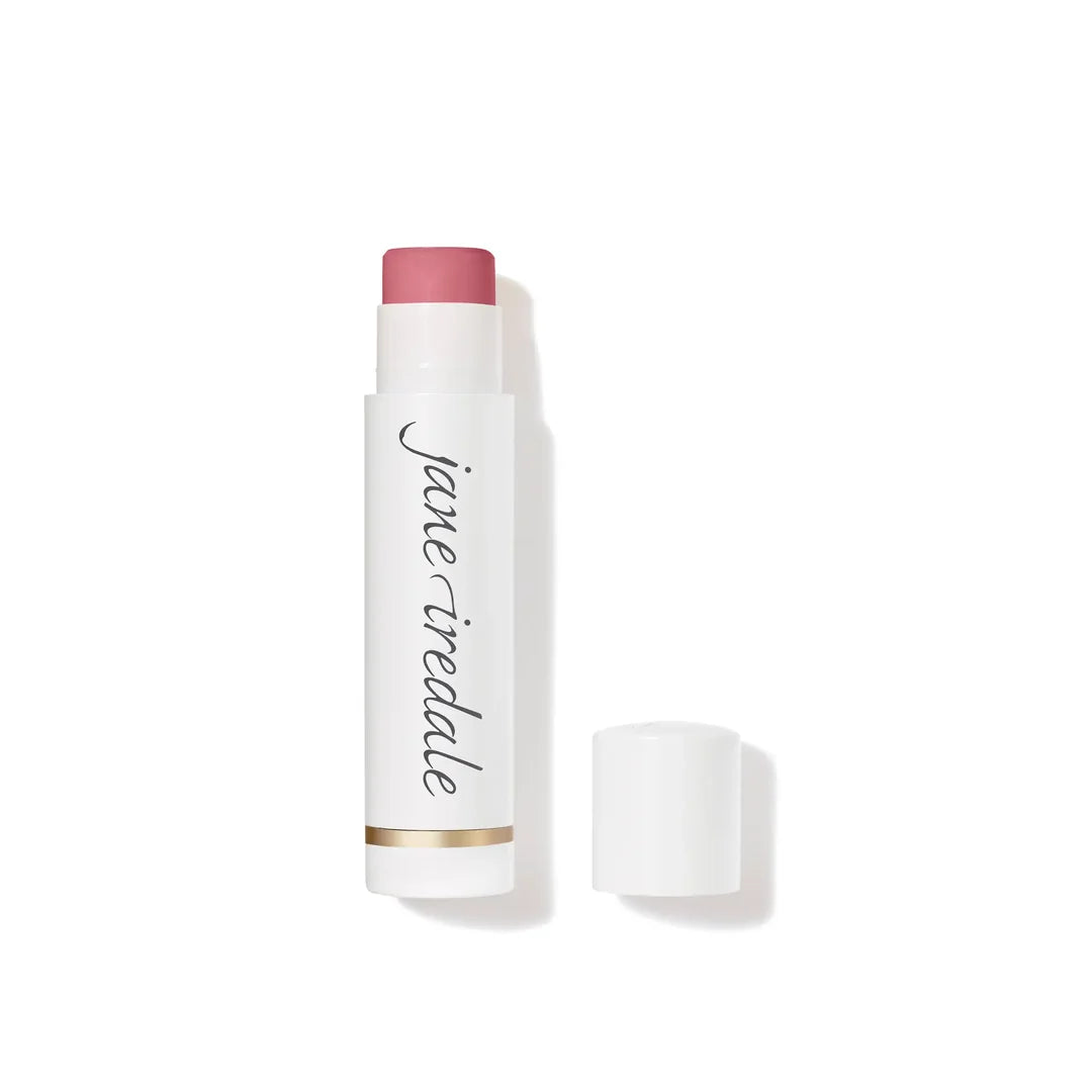  jane iredale LipDrink Lip Balm in Flirt, shown uncapped in a white tube beside its lid on a white background.