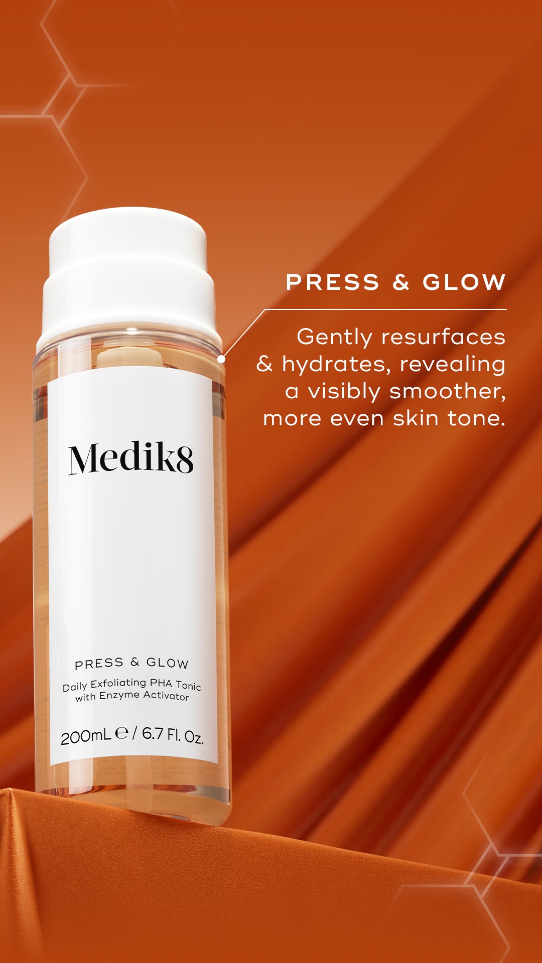Mediks Press & Glow Daily Exfoliating PHA Toner bottle on a draped orange background with product text overlay.